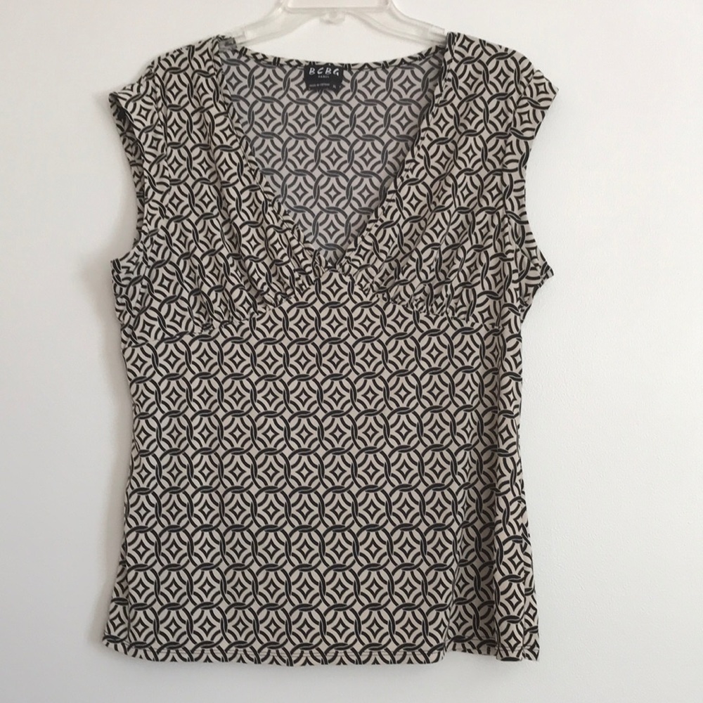 BCBG Paris blouse. SizeXL, fits L